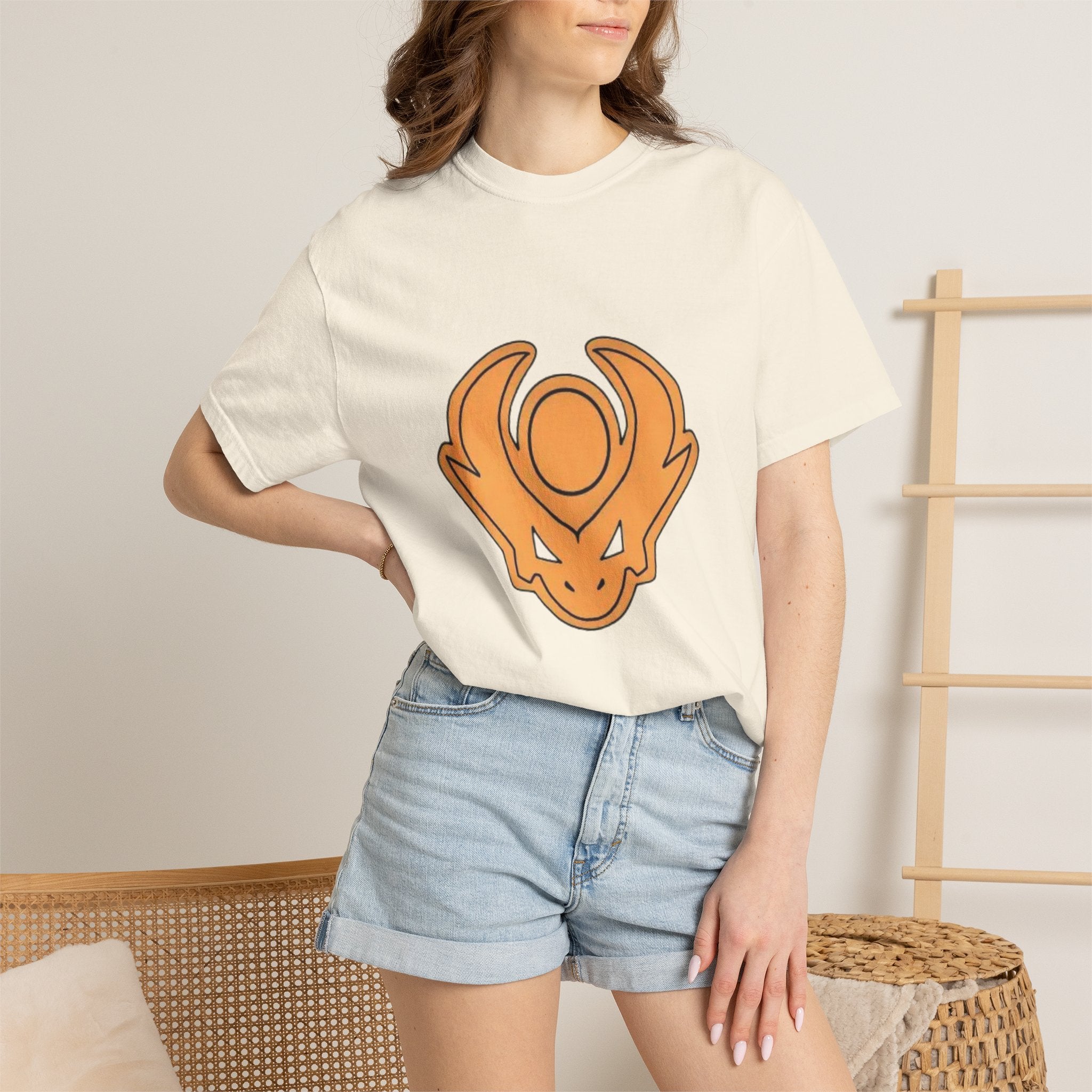 Graphic T-Shirt — Orange Emblem Front & “Fear Isn't a Word From Where I Come From” Back